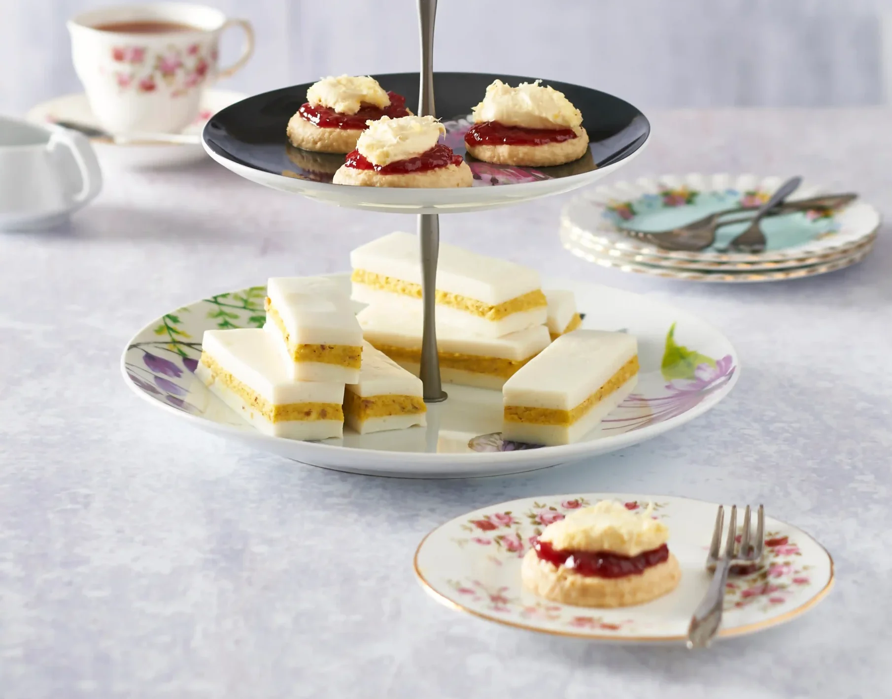 small cakes on a three tier cake stand