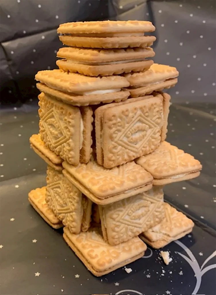 custard cream biscuits stacked in a tower