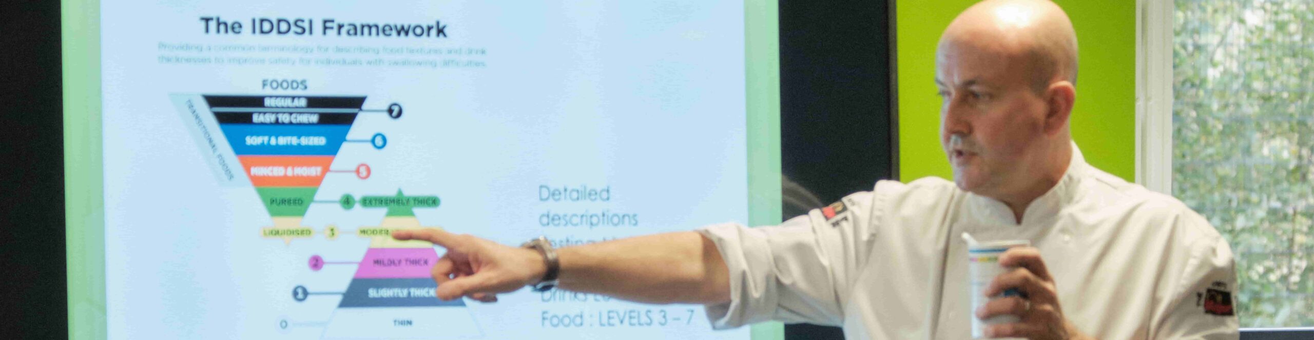Chef pointing at IDDSI framework