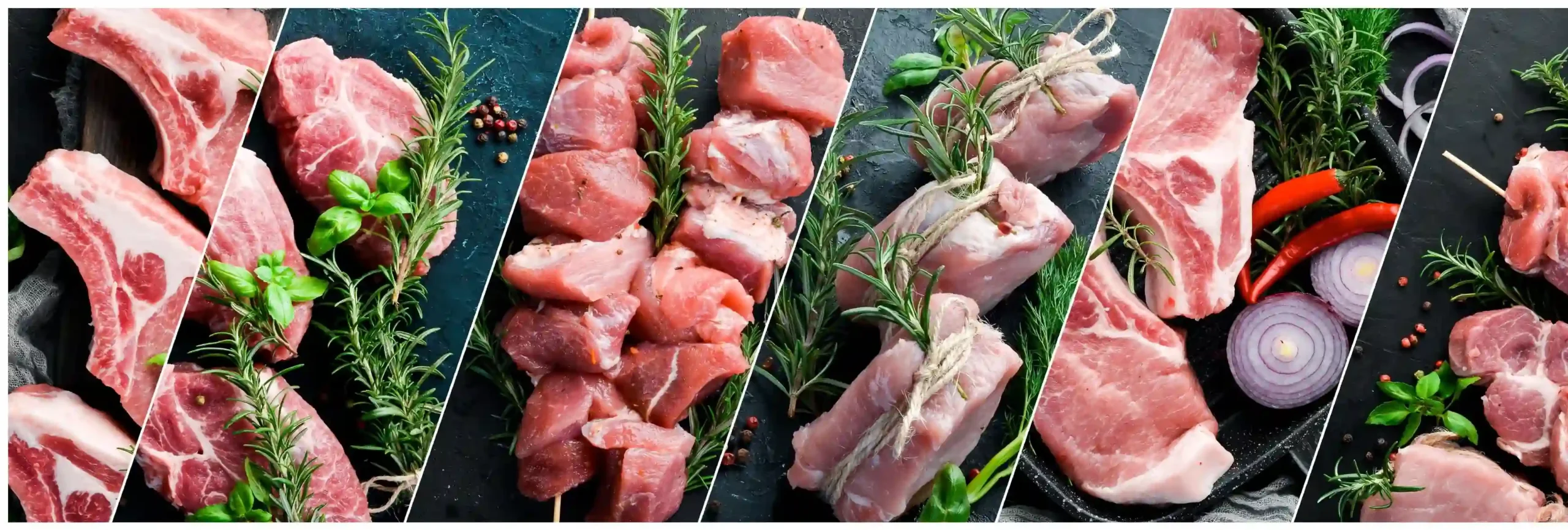 Assorted raw meat cuts displayed with fresh herbs and spices on slate